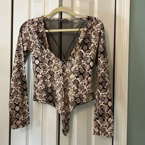 Victorias Secret Sheer back Long sleeve body suit. Deep vneck Worn once.